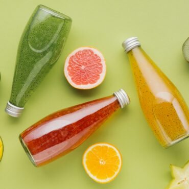 colorful-juice-bottles-fruit-slices