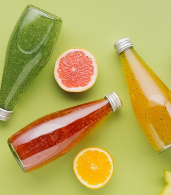 colorful-juice-bottles-fruit-slices colorful-juice-bottles-fruit-slices